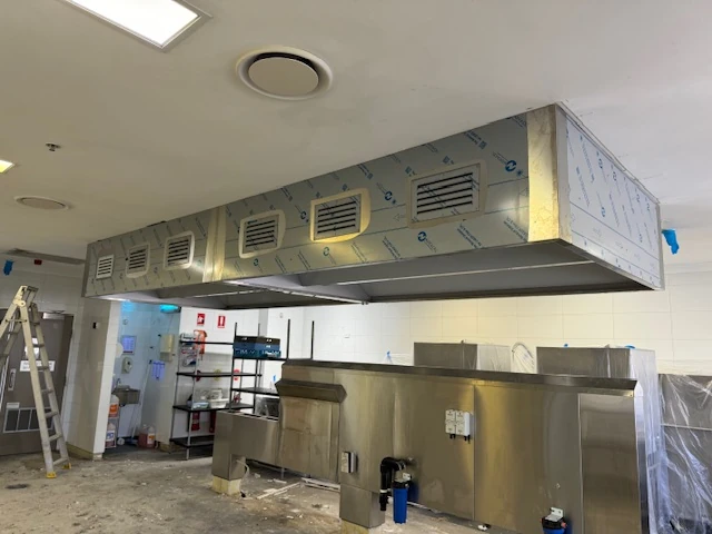 Commercial kitchen canopy and ductwork installation in progress