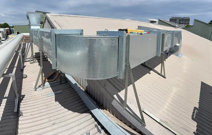 Commercial exhaust fans and ductwork on a rooftop